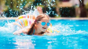A girl swimming in a swimming pool